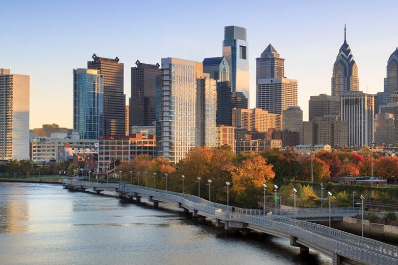 a city skyline with a river