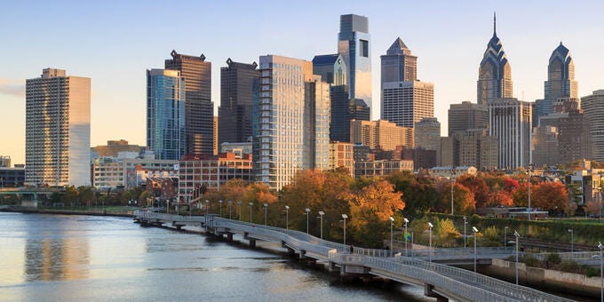 a city skyline with a river