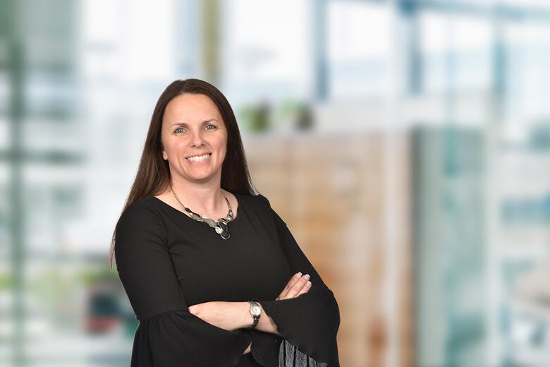 a woman with her arms crossed