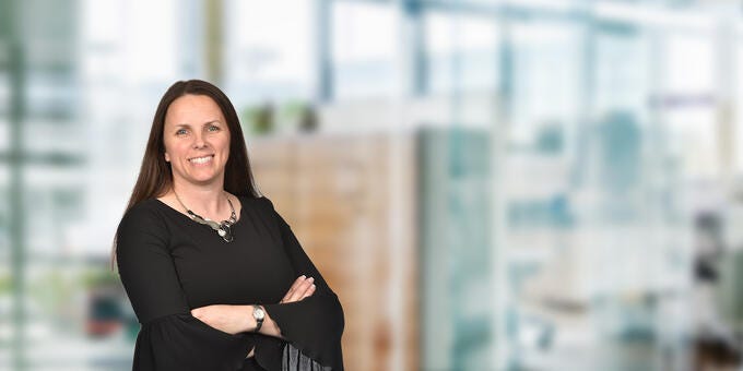 a woman with her arms crossed