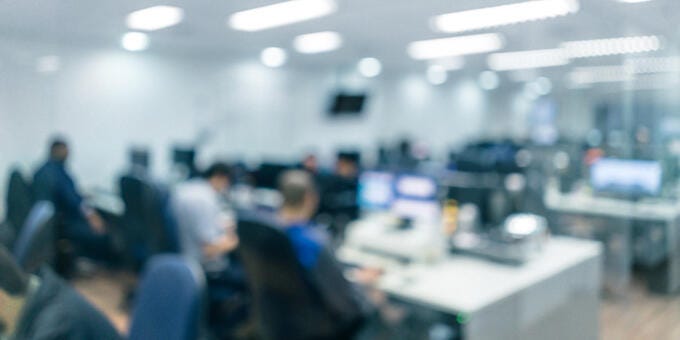 a group of people working in an office