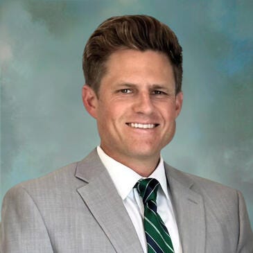 a man in a suit and tie