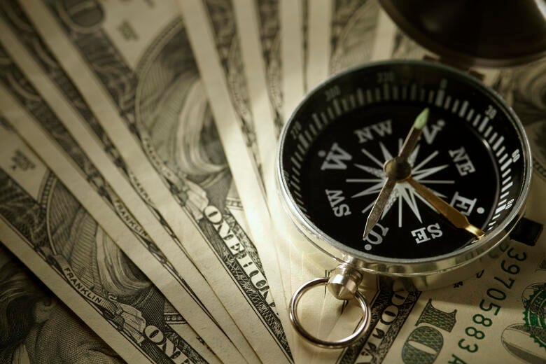 a clock on top of money