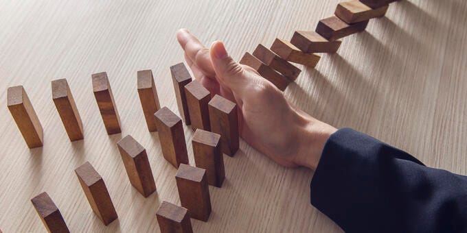 a hand on a wooden board