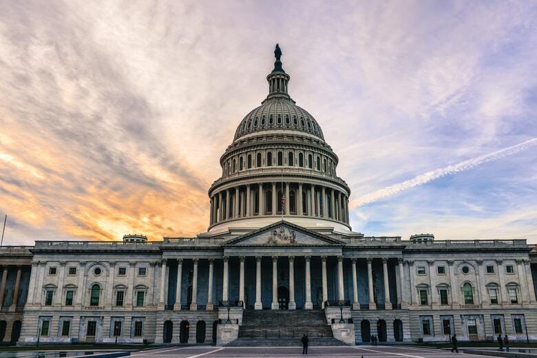 a large building with a dome and columns