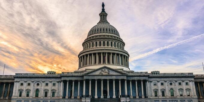 a large building with a dome and columns
