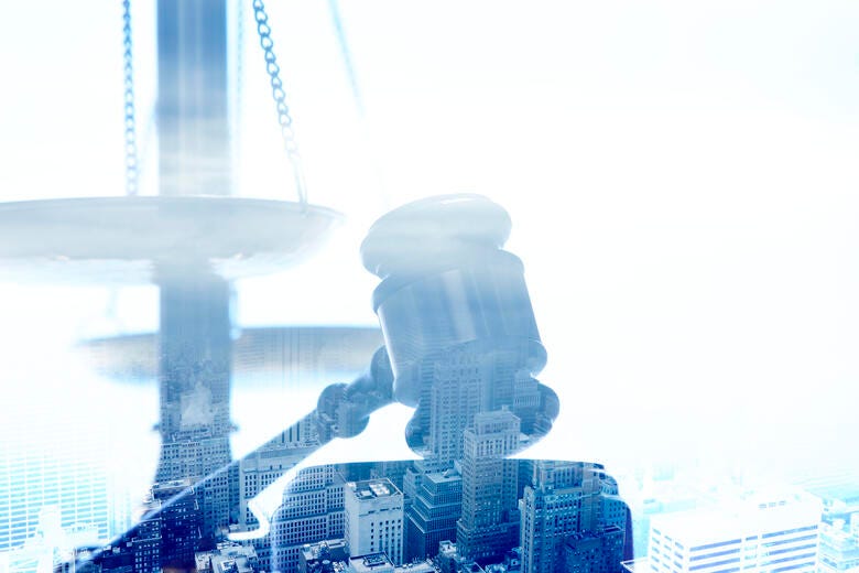 a statue of a man with a hat and a gun