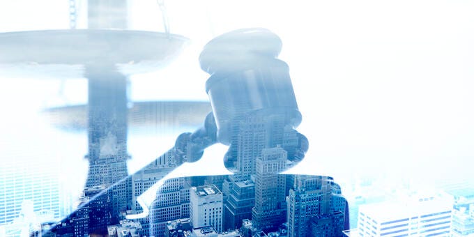 a statue of a man with a hat and a gun