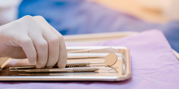 a hand holding a pen