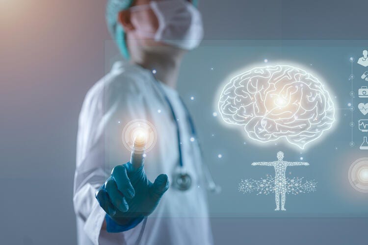 a person in a lab coat holding a light bulb