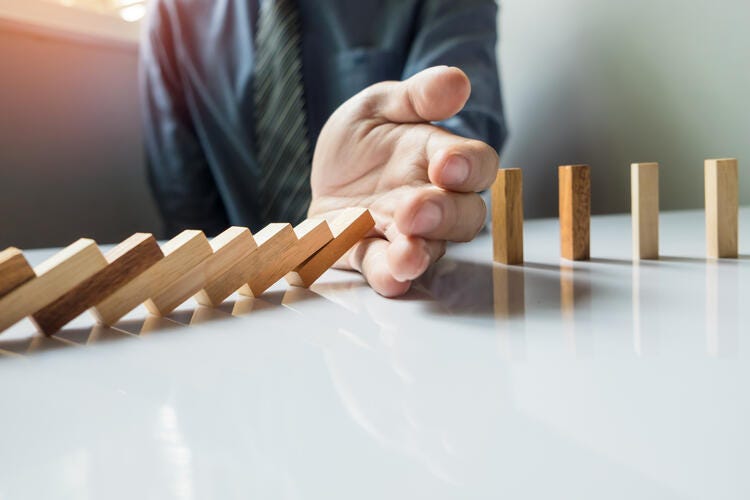 a hand playing a game