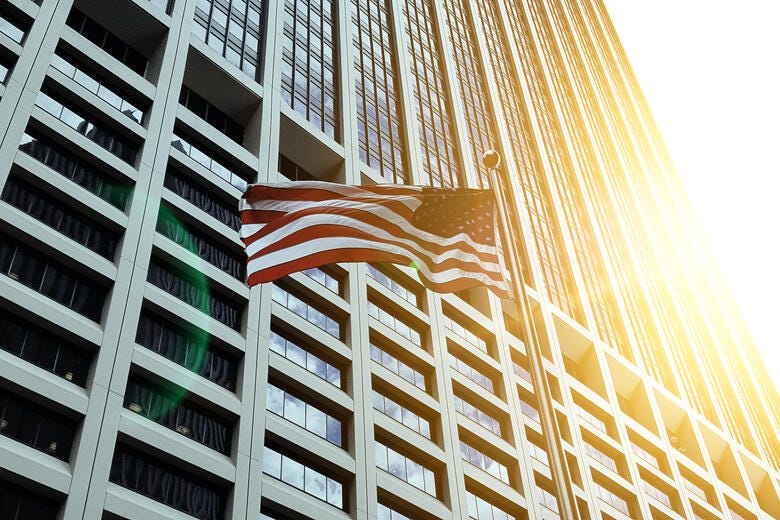 a building with a large fire coming out of the top