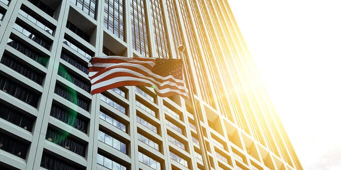 a building with a large fire coming out of the top