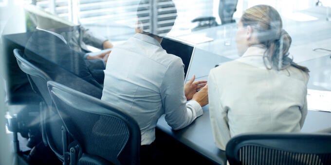a few people sitting at a table