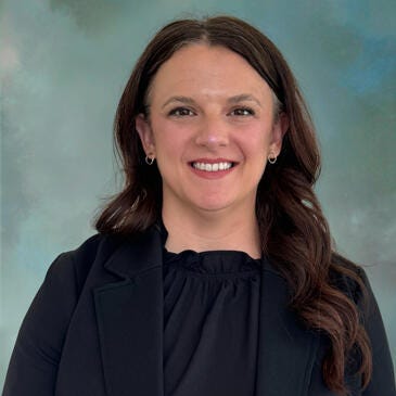 a woman smiling for the camera