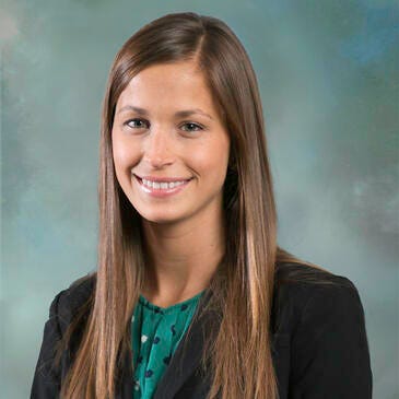a woman with long hair smiling