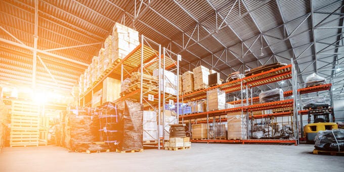 a warehouse with stacks of wood
