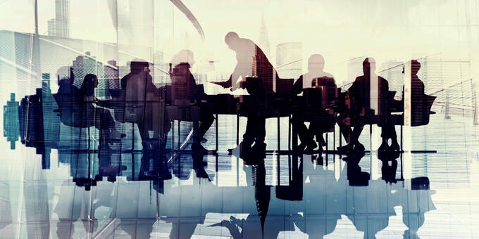 a group of people standing in front of a window