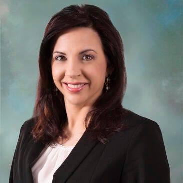 a woman smiling for the camera