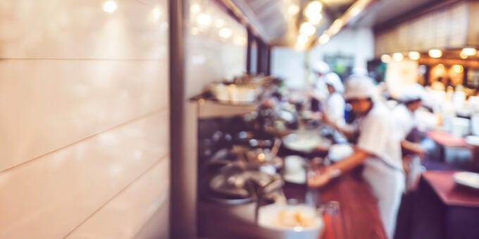 a group of chefs in a kitchen