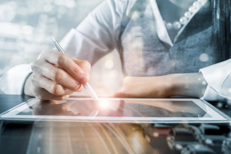 business man writing smart pad