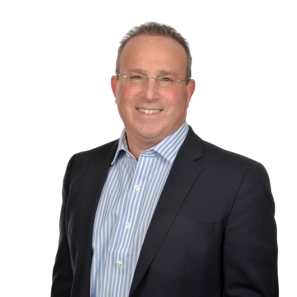 a man wearing a suit and smiling