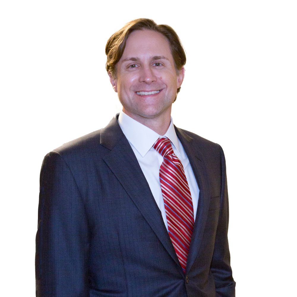 a man in a suit smiling