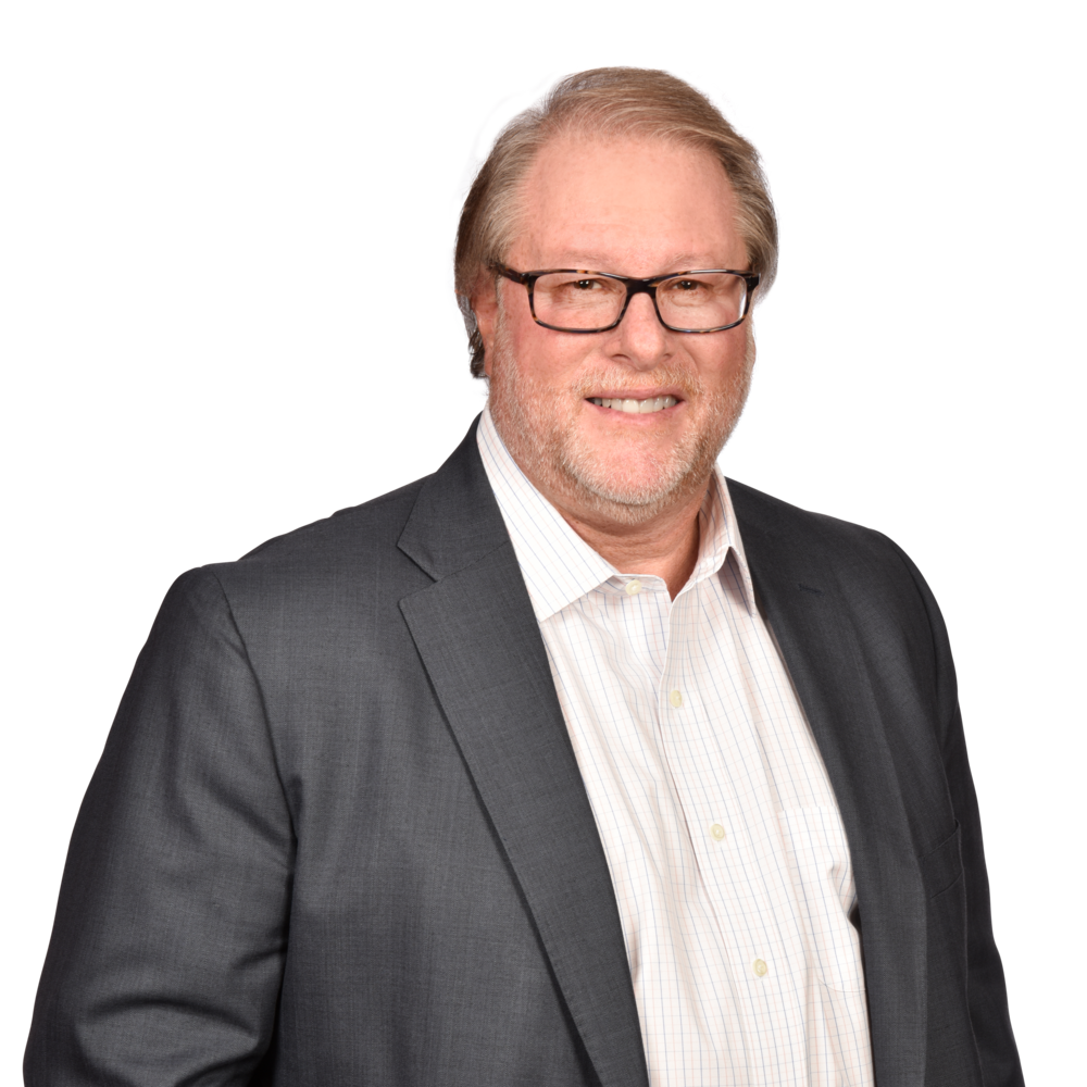 a man wearing a suit and glasses