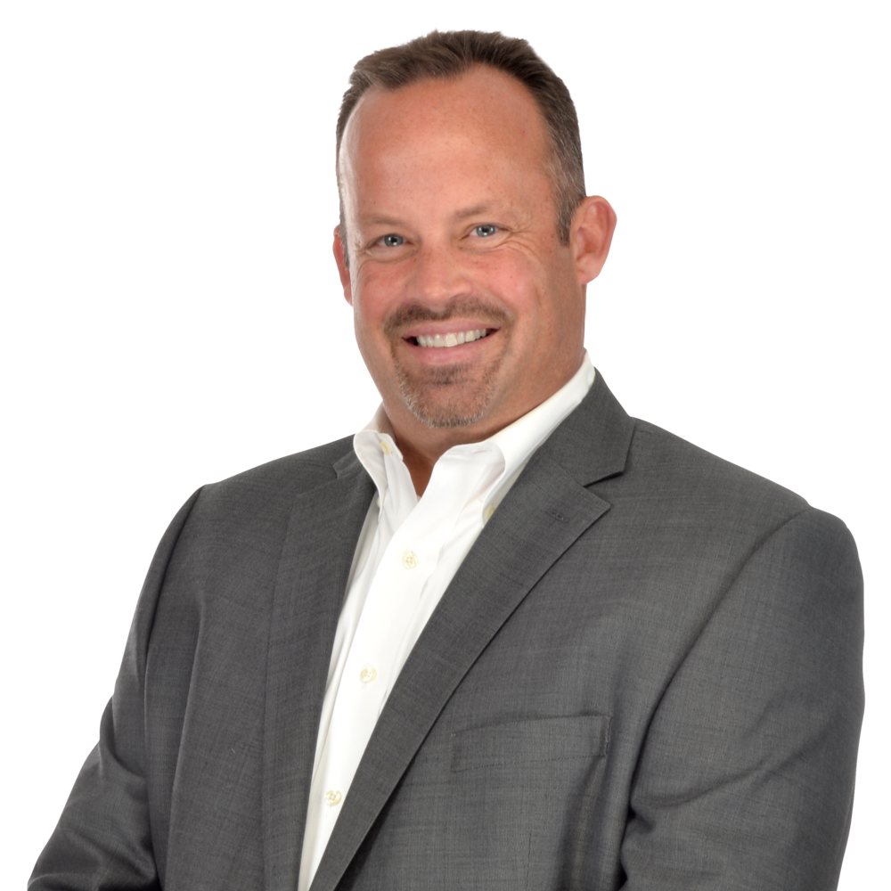 a man in a suit smiling